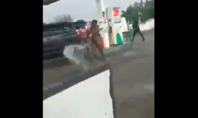ICYMI: Watch Viral Video Of Moment Woman Goes Naked At Filling Station, Sprays Fuel