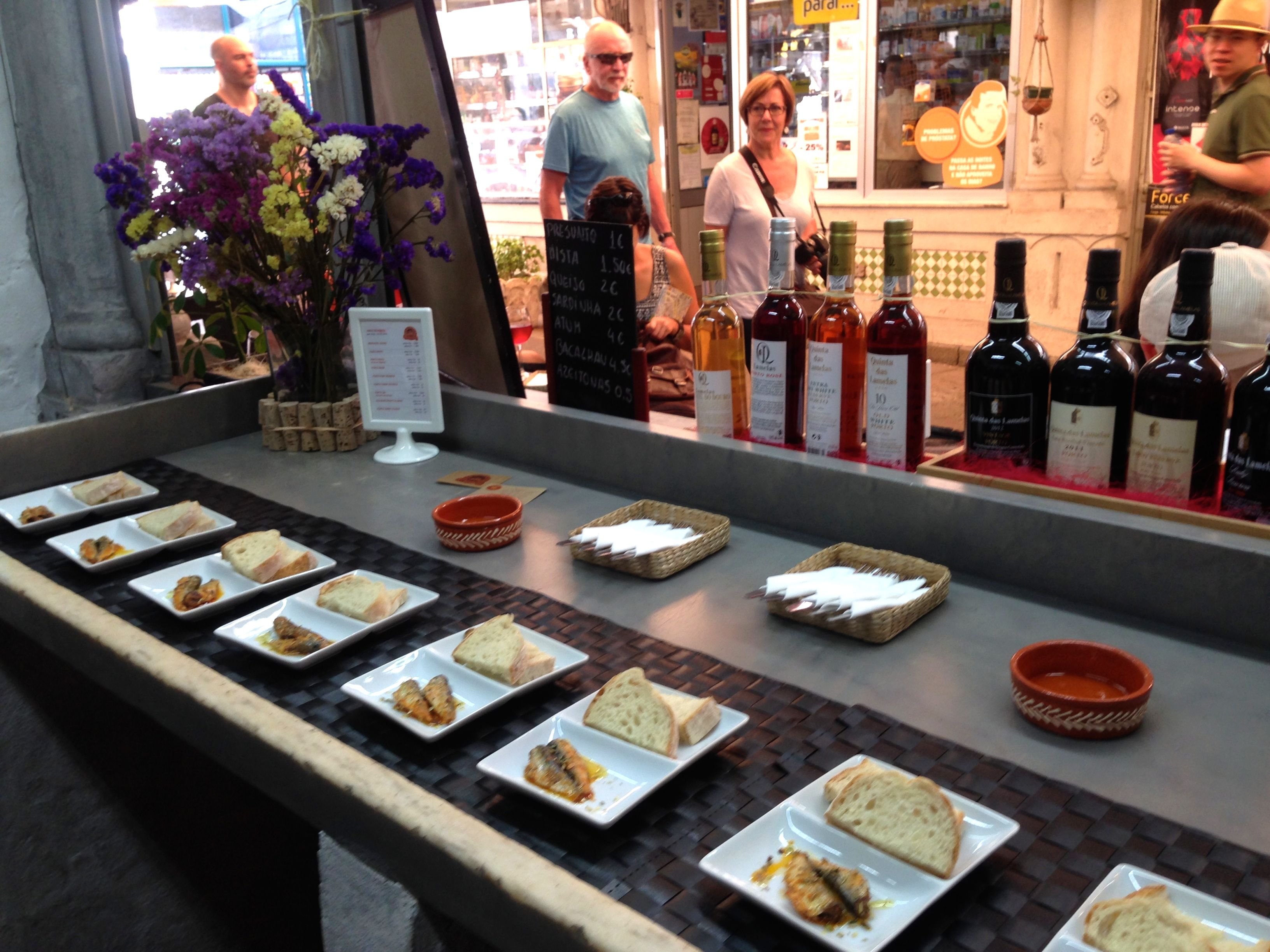 A cheese and moscatel tasting at Balhão Wine House in the Balhão market.