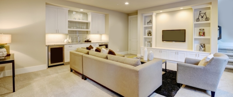 finished basement home theater with neutral colors