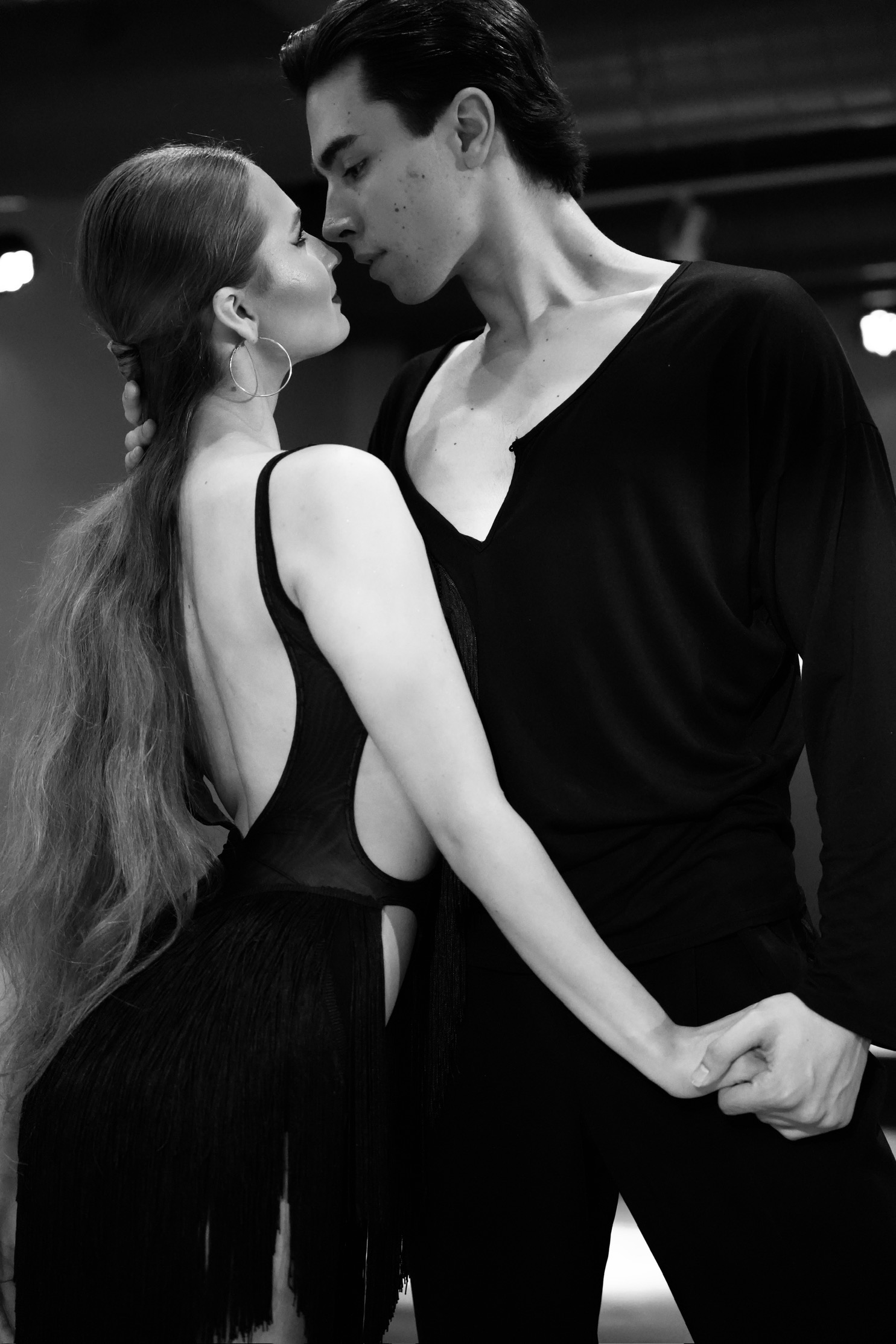 Kye and Anna sharing focus in a close dance position