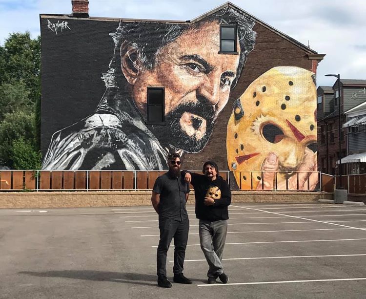 Jeremy Raymer paints mural of special effects artist Tom Savini in