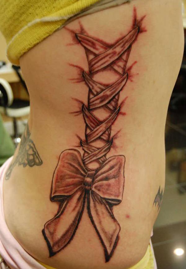 64 Magnificent Examples For Tattoos On The Rib - Nexttattoos 865_x_600_jpg