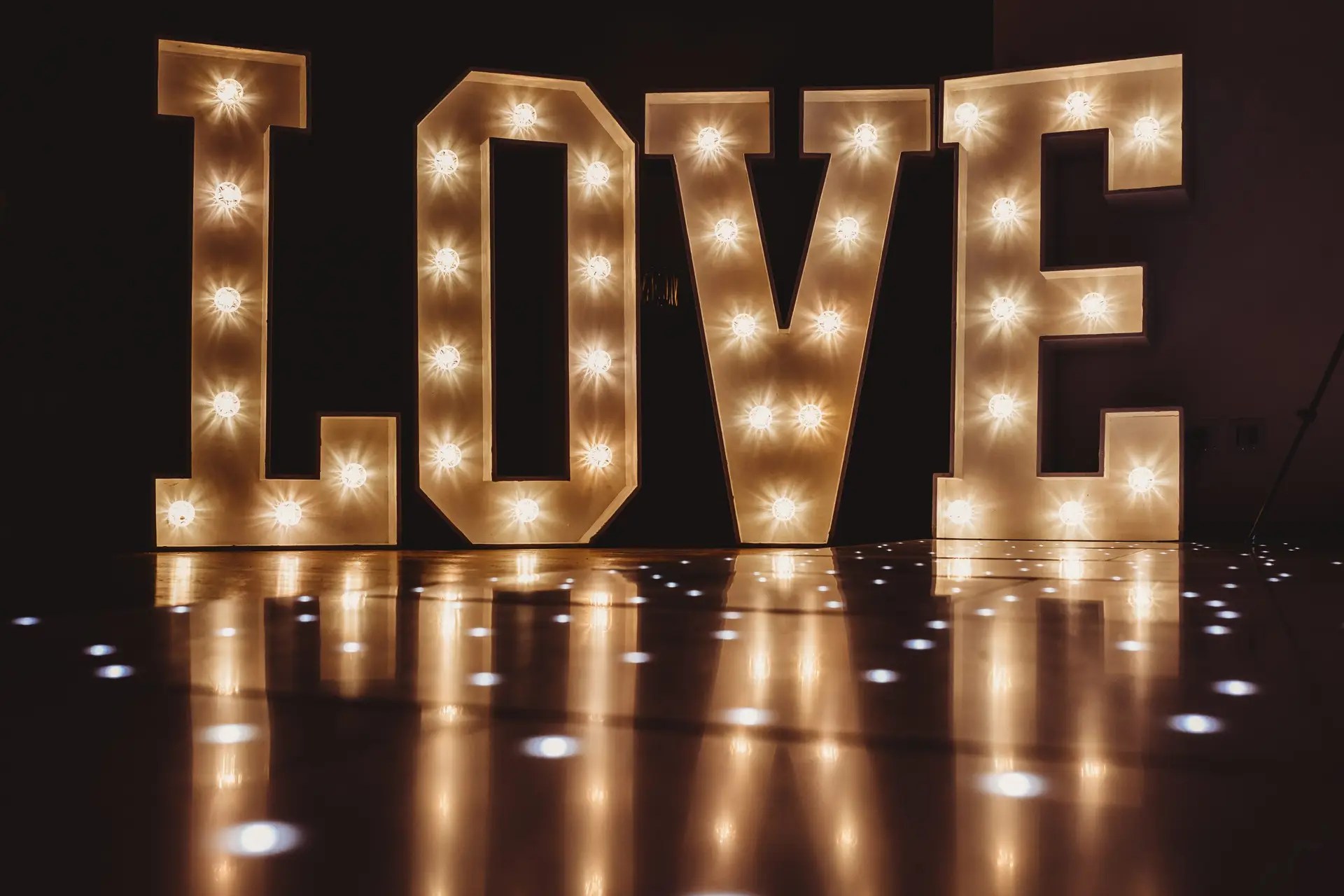 LOVE Letters – From £175 Our 4ft ‘LOVE’ letters are the essence of romance turned into a radiant spectacle. Each letter stands tall, casting a soft, inviting glow that harmonises with the joyful celebration of your union. These aren’t just letters; they are the beacons of your love story, meticulously designed with bright, energy-efficient LED bulbs that offer an enchanting luminescence to your venue. Whether nestled by the dance floor, welcoming guests at the entrance, or serving as an exquisite photo backdrop, our ‘LOVE’ letters are more than decor—they are a memorable experience. Their timeless design complements any wedding theme, from the ultra-modern to the whimsically vintage, transforming your space into a storybook setting. Mr & Mrs Letters – From £225 Celebrate the beginning of your forever with our ‘Mr & Mrs’ letters, a testament to your newly shared surname. These 4ft symbols of commitment and togetherness are not only an elegant decorative element but also a tribute to the journey you embark upon as life partners. Each character glows with the promise of future happiness, standing as a proud announcement of your marital bond. The letters’ soft lighting adds an air of sophistication to your reception, inviting guests to revel in the essence of your wedding day. Designed with versatility in mind, they adapt seamlessly to any setting, providing a focal point that is both visually stunning and deeply personal. These letters don’t just spell out a title; they encapsulate the essence of the wedding celebration—unity, love, and a touch of grandeur.