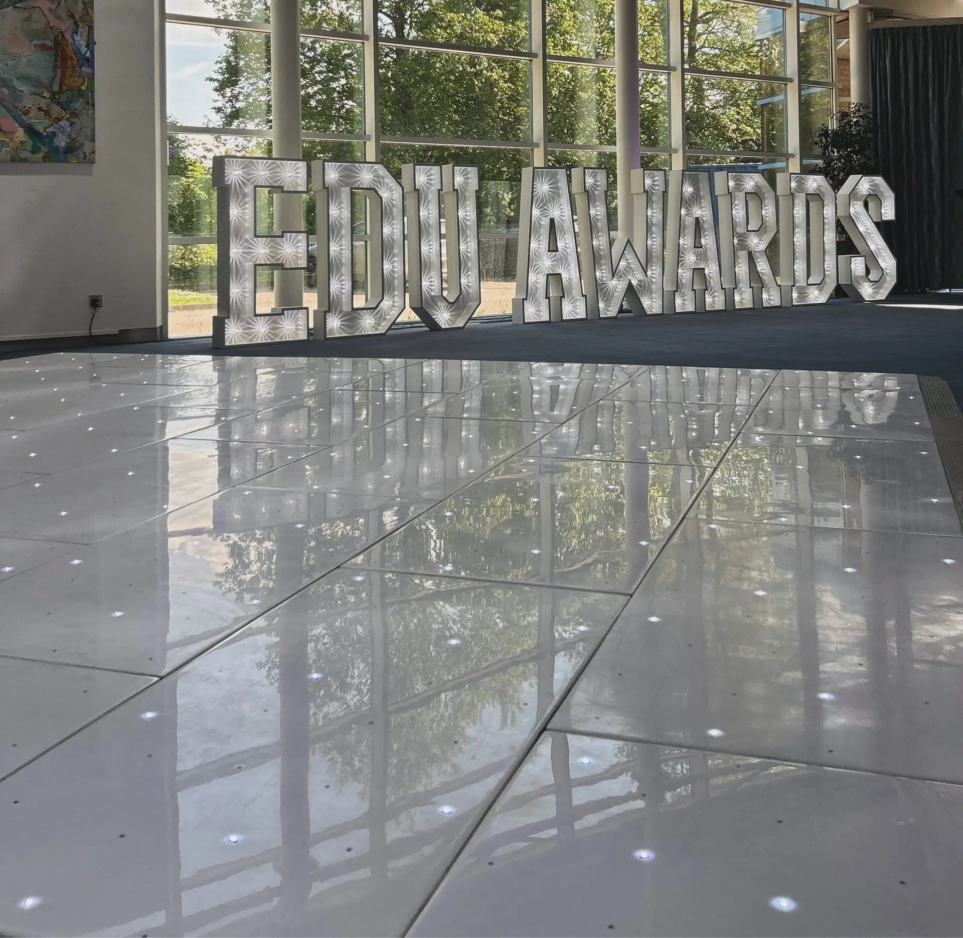 Image showcasing Nextwave Events & Hire's event equipment and services, including LED dancefloor hire, light-up numbers, light-up letters, staging, and special effects for weddings, birthdays, and events.