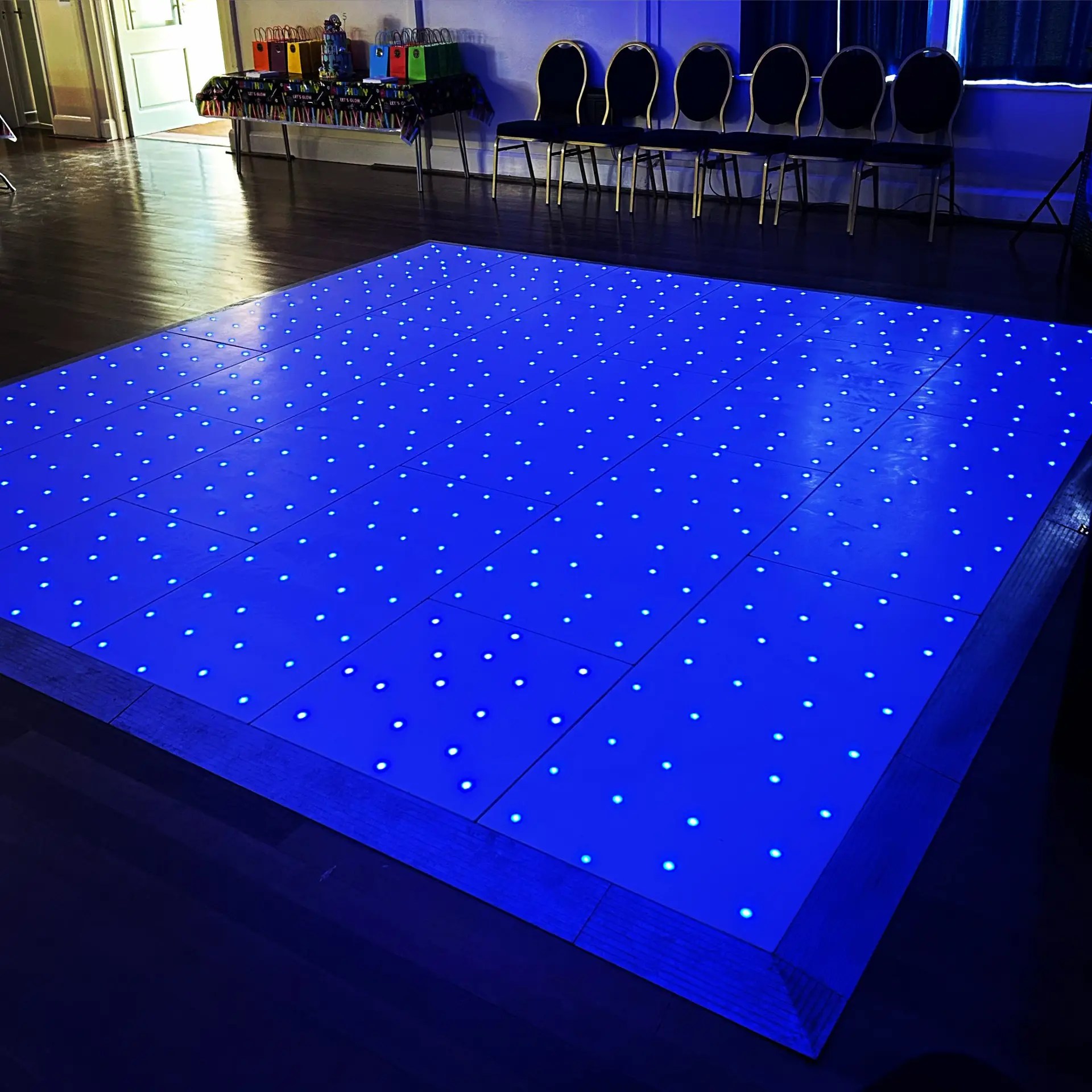 Image showcasing Nextwave Events & Hire's event equipment and services, including LED dancefloor hire, light-up numbers, light-up letters, staging, and special effects for weddings, birthdays, and events.