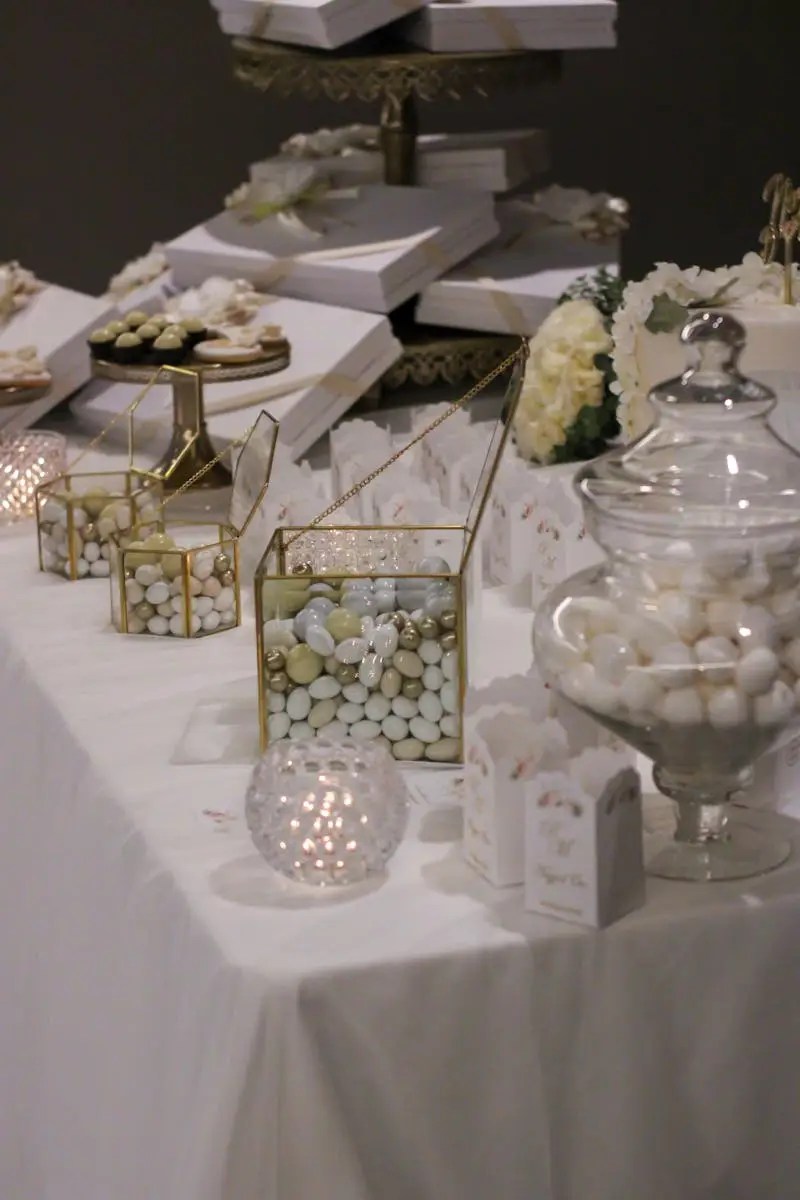 Wedding Decoration, Sweets and Gifts on a Table with White Tablecloth