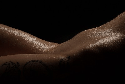Fine art nude portrait close-up emphasizing texture and light