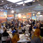 Visitors test playing board game