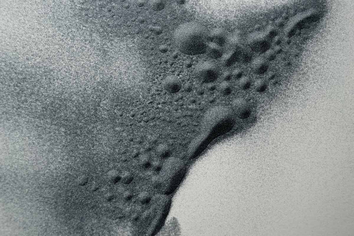 sound image (photographic documentation) - patterns in caborundum created by sound vibrations, approximate area pictured 14 x 18 inches