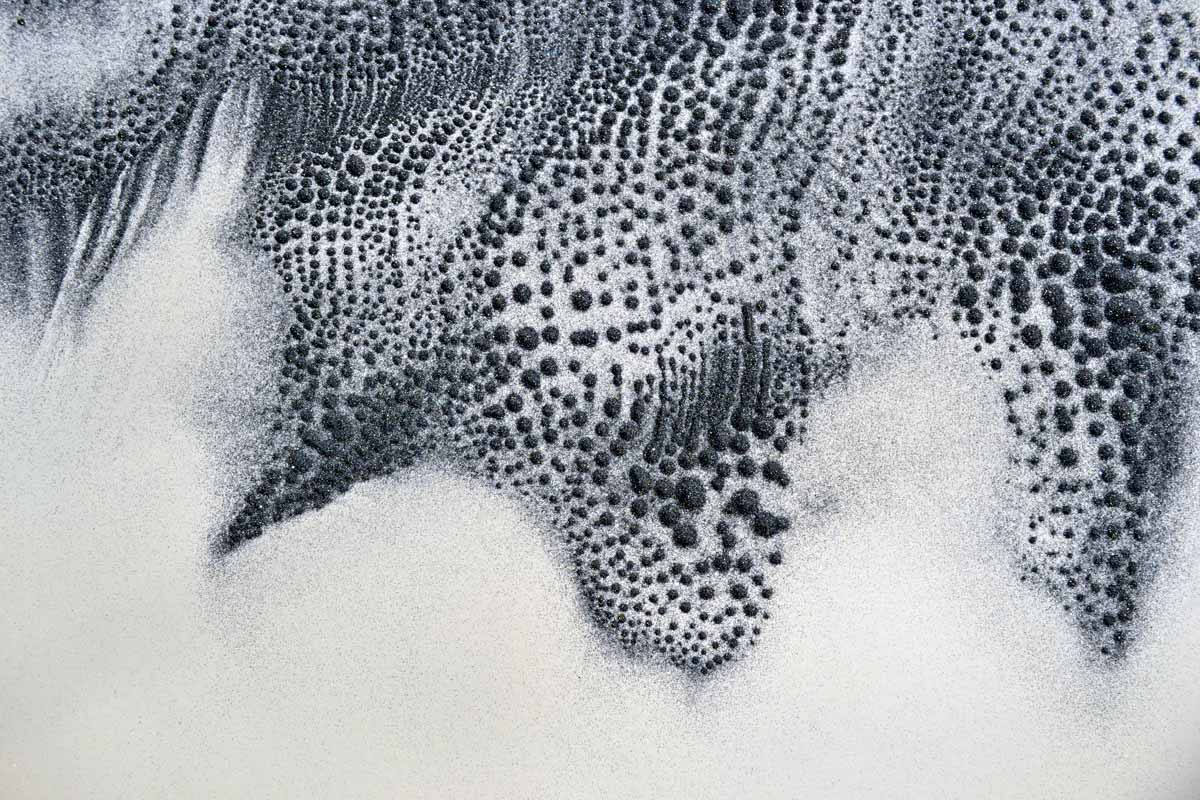 sound image (photographic documentation) - patterns in caborundum created by sound vibrations, approximate area pictured 20 x 20 inches