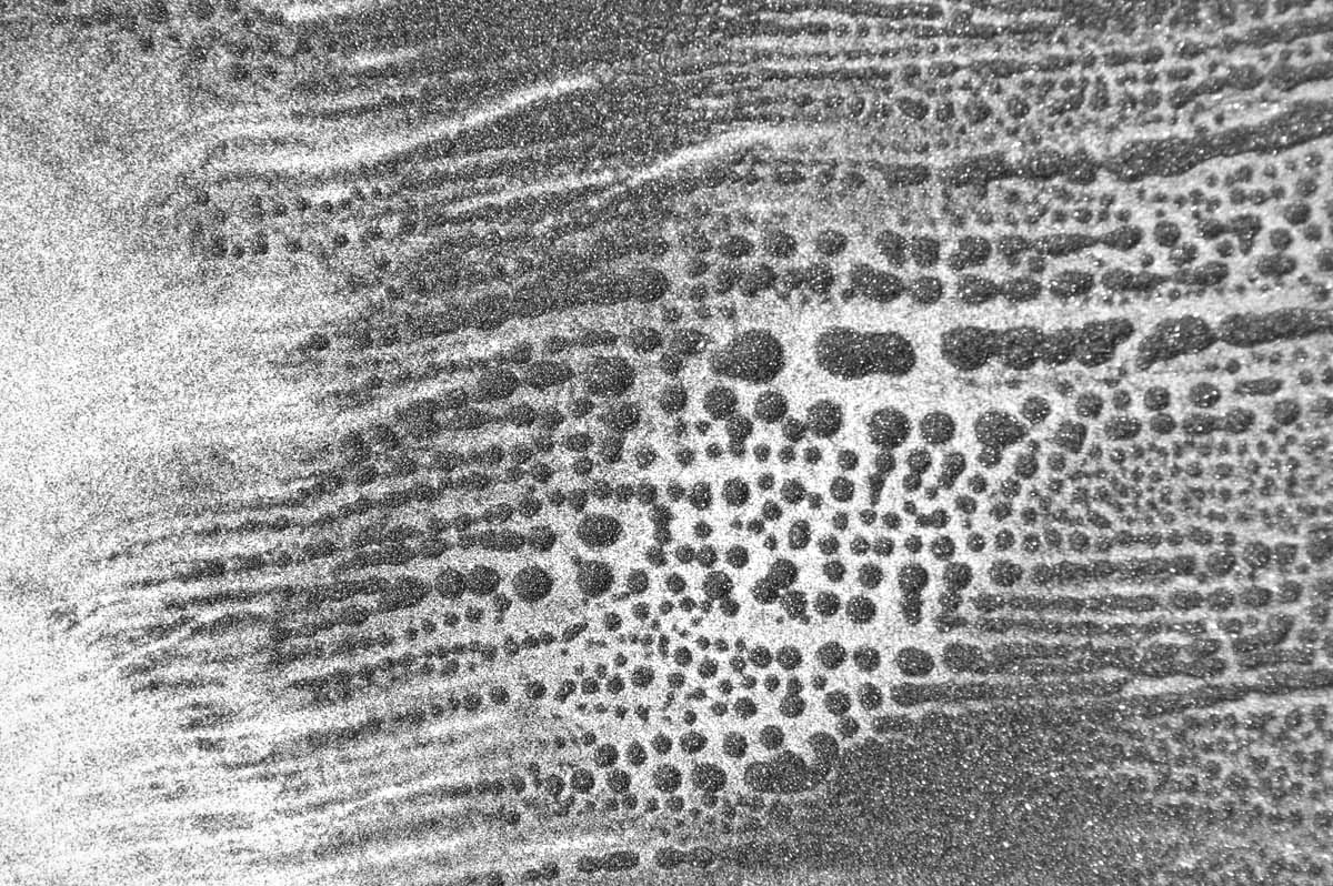 sound image (photographic documentation) - patterns in caborundum created by sound vibrations, approximate area pictured 12 x 14 inches