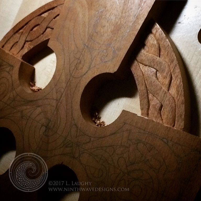 The first arm support is carved.