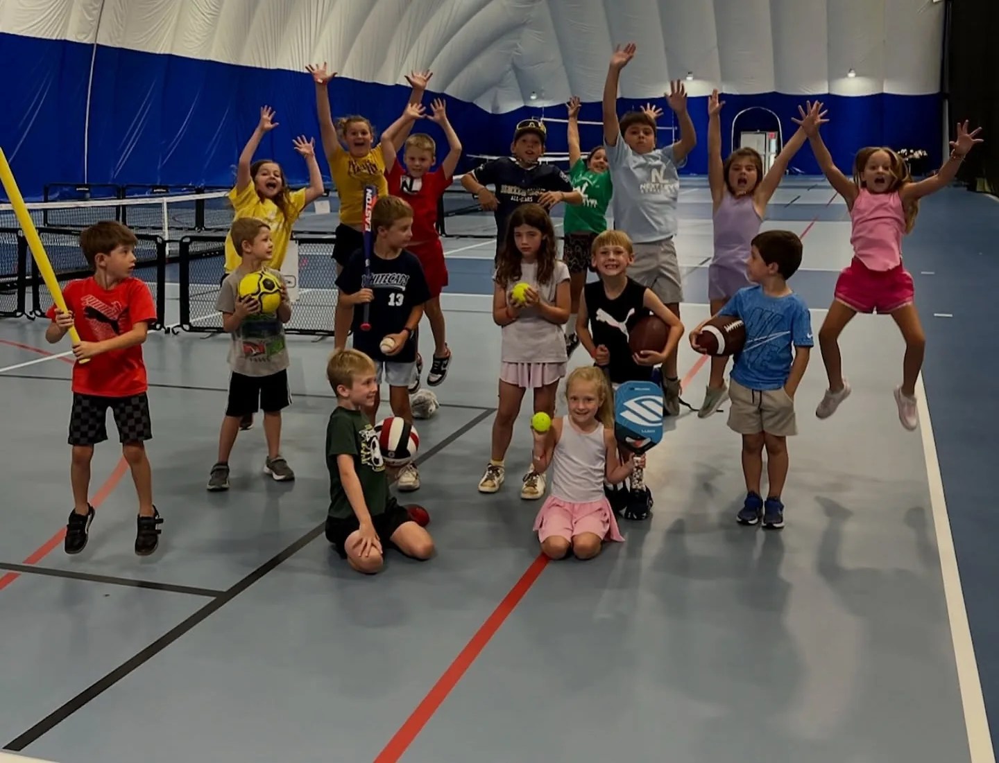 Kids ages 4 to 10 on the courts at the Kalsee Dome for the Explore multi-sport program