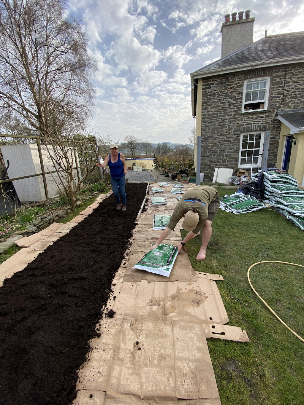 Ruairi weighing down cardboard