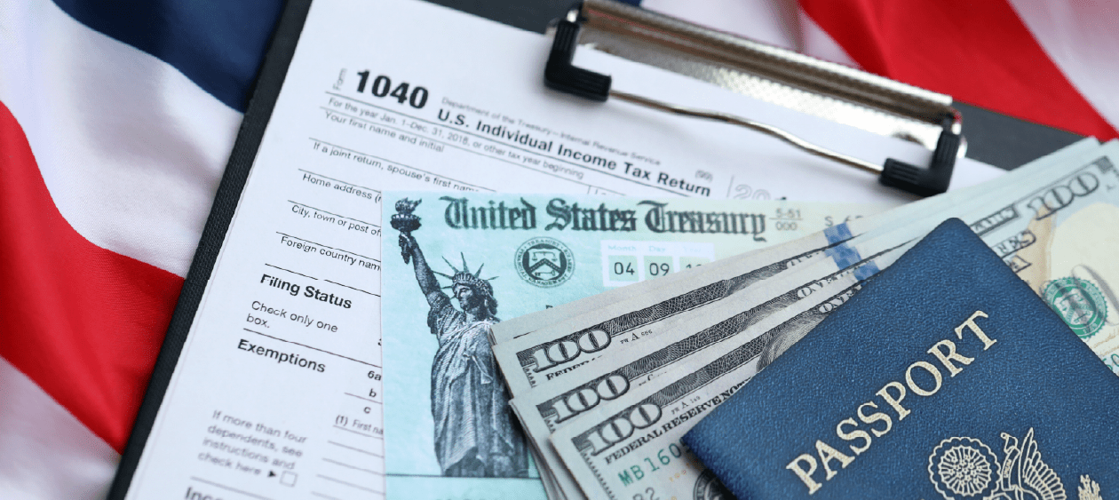 Form 1040, US Treasury refund check, passport and cash — Nolly guides non-U.S. freelancers through the ITIN application process