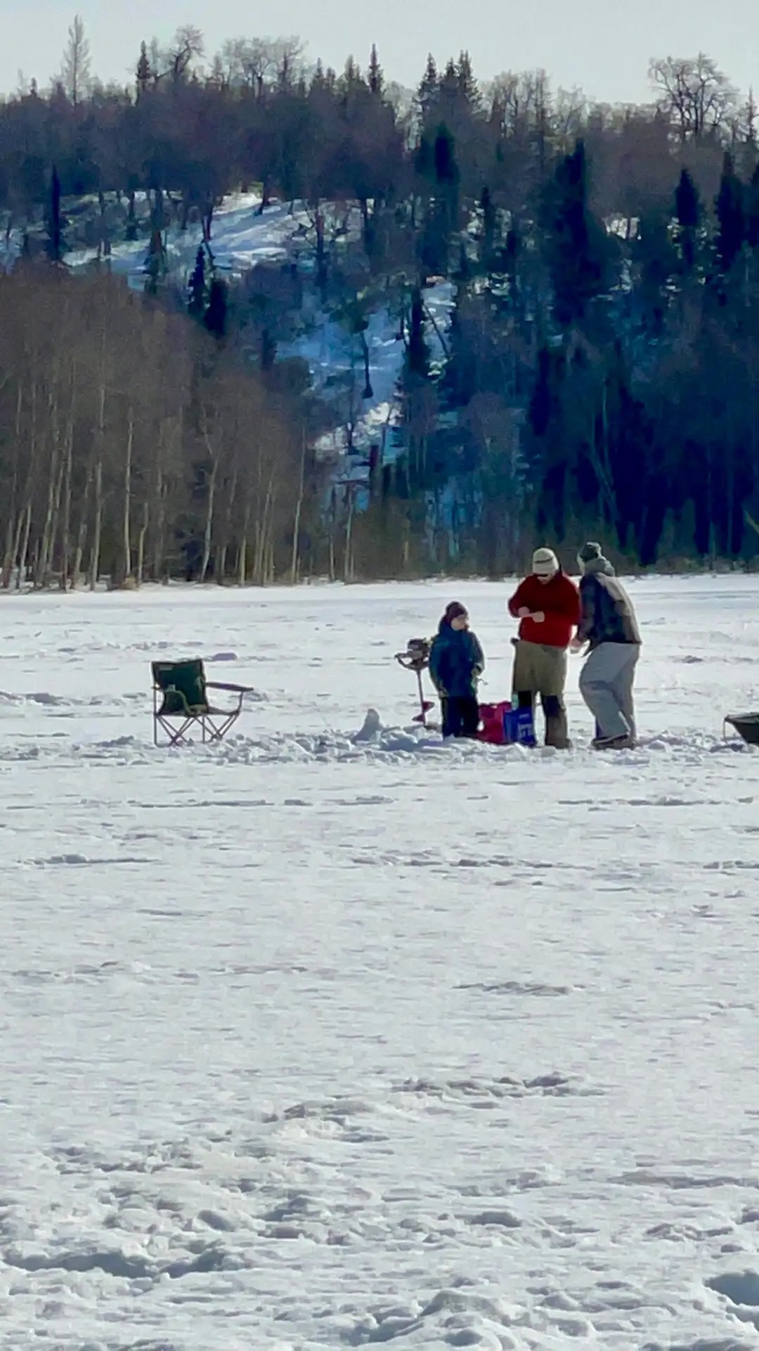 People ice fishing
