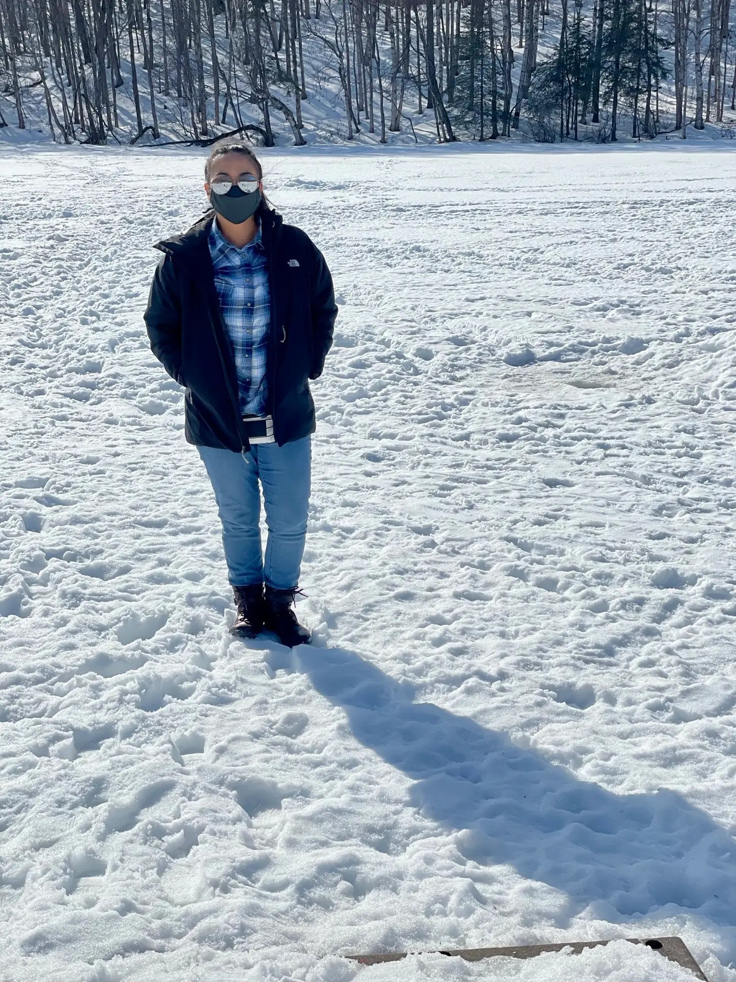 Tiff standing on a frozen lake