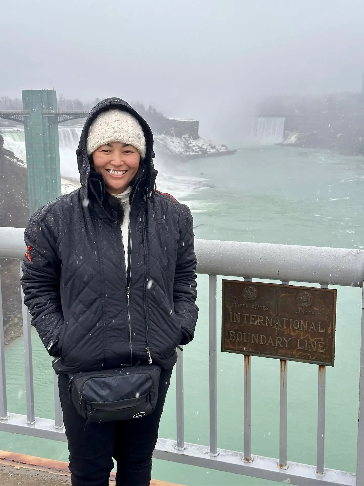 Tiff on the border of the US and Canada, loving the snow...