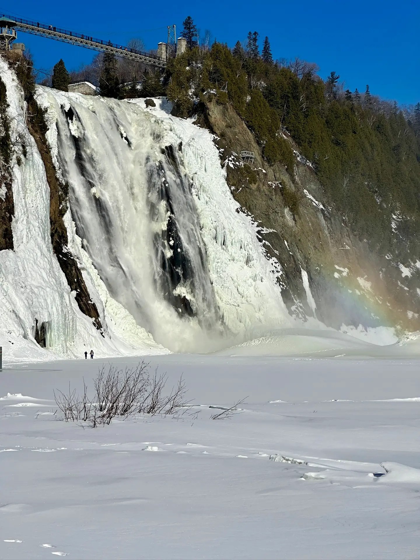 Montmorency Falls with a rainbow. You can see the sugar loaf at the base of the falls, too.