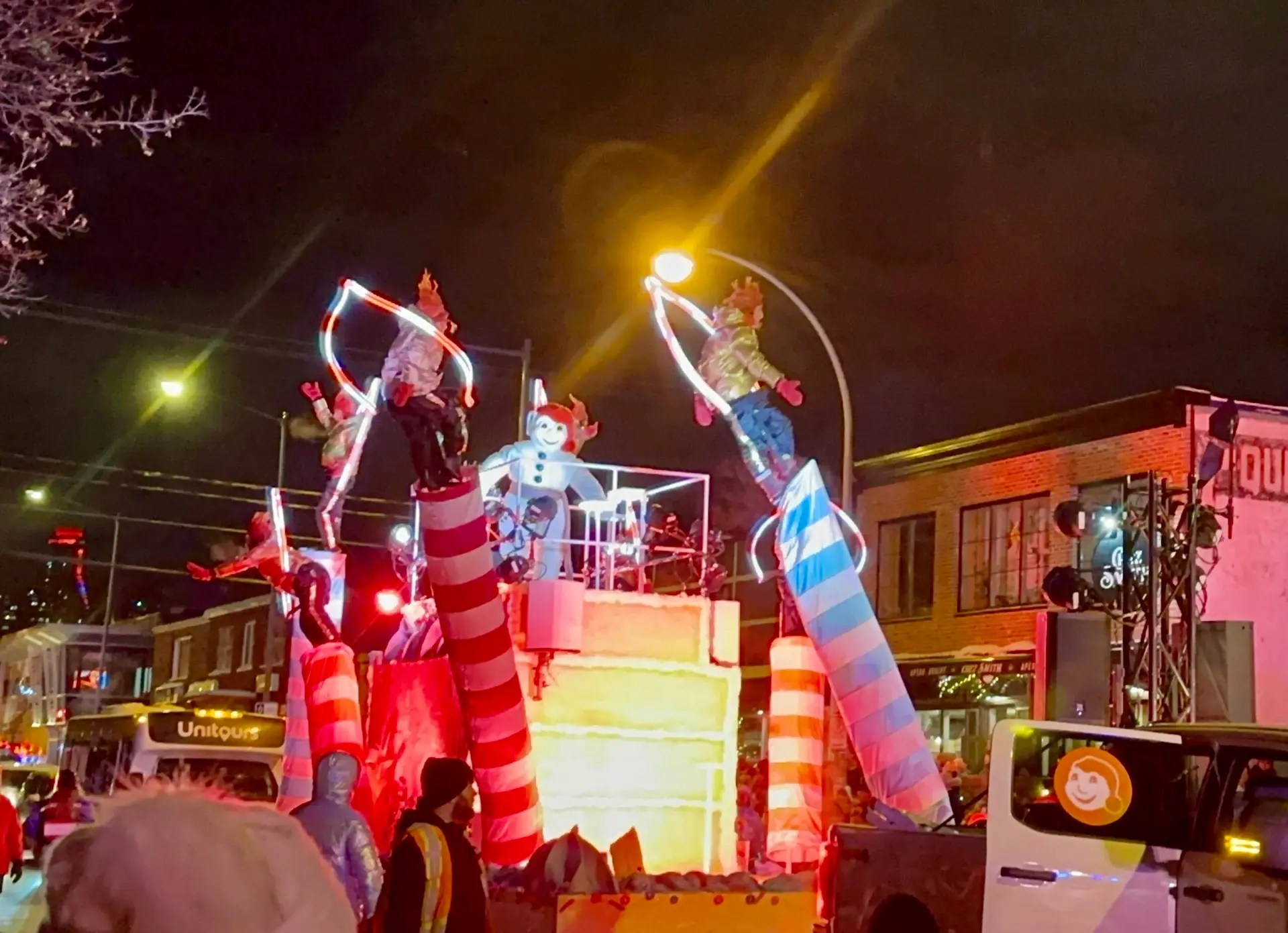 Human candlesticks in the night parade