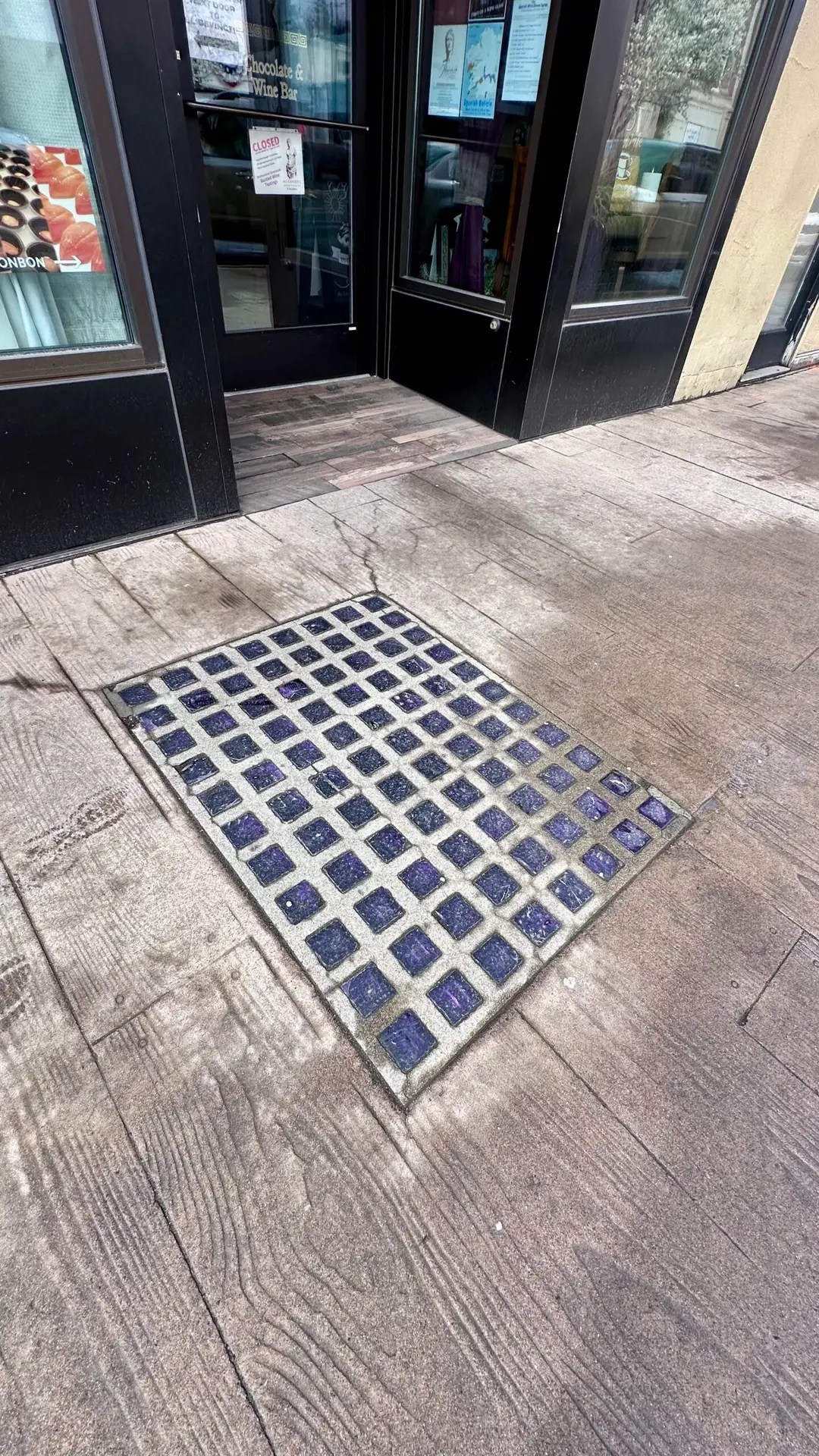 These were built into the sidewalks to provide light to the underground whilst hiding what lay beneath.