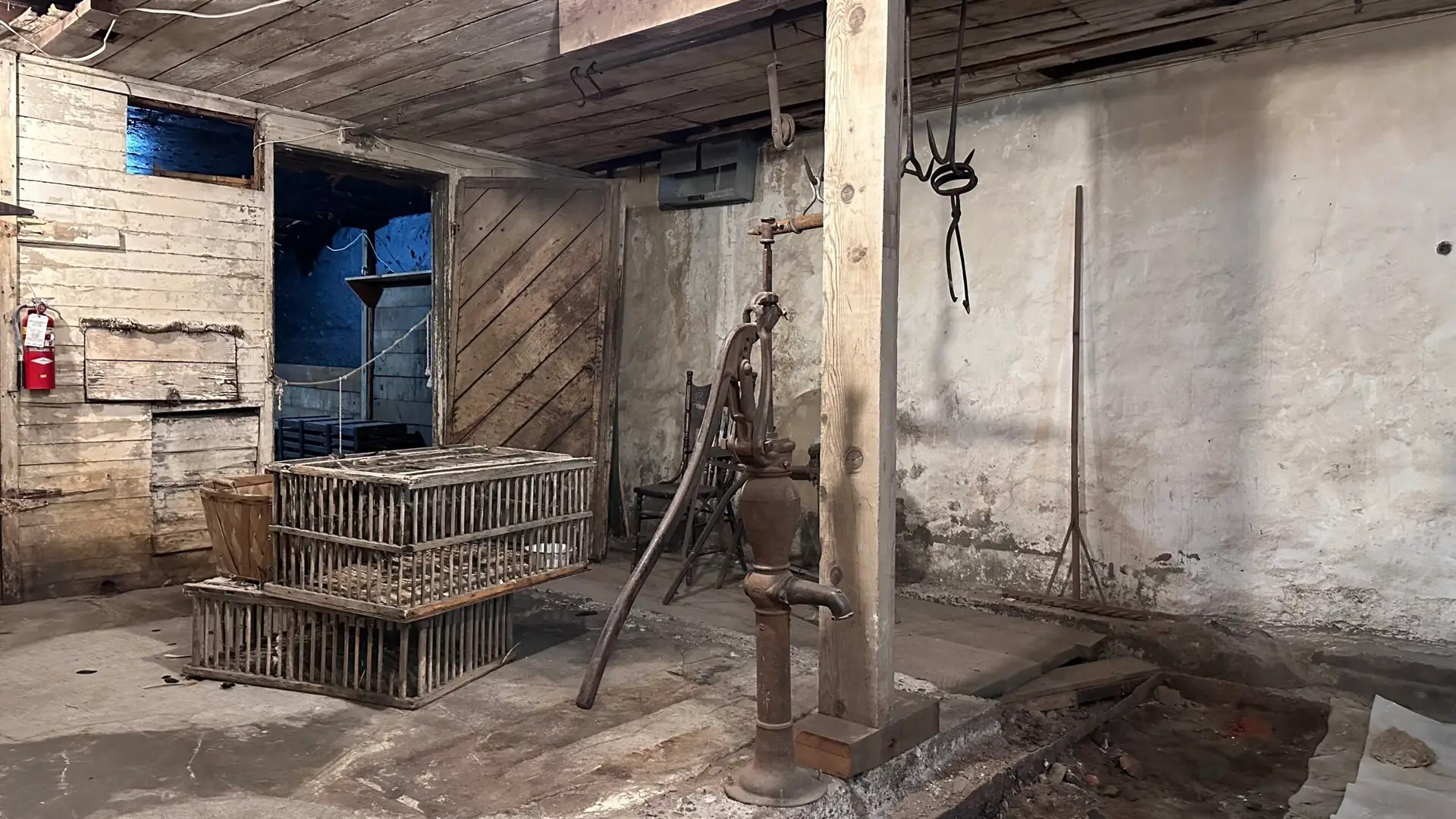 Part of the meat market. Under the board in the back is a fresh water well. They used this to make ice.