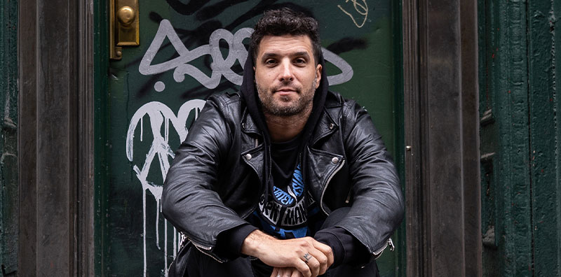 Shai Dahan poses wearing a black jacket