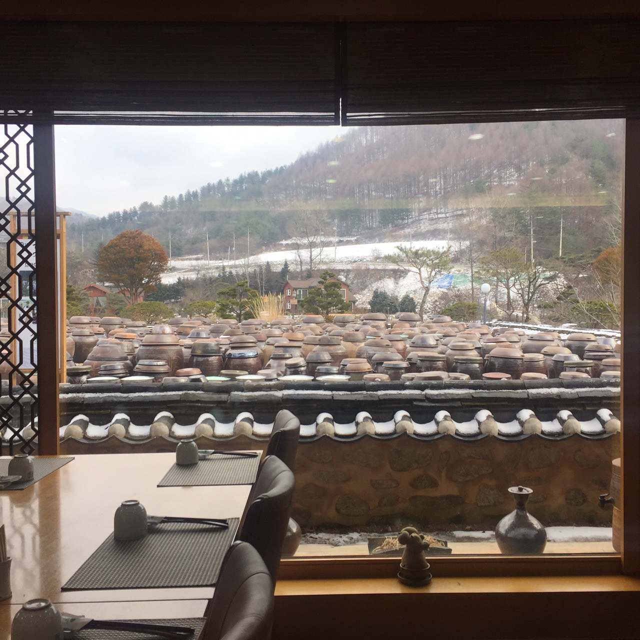Looking out to Jung Gang Won's window into the yard of Traditional claypots