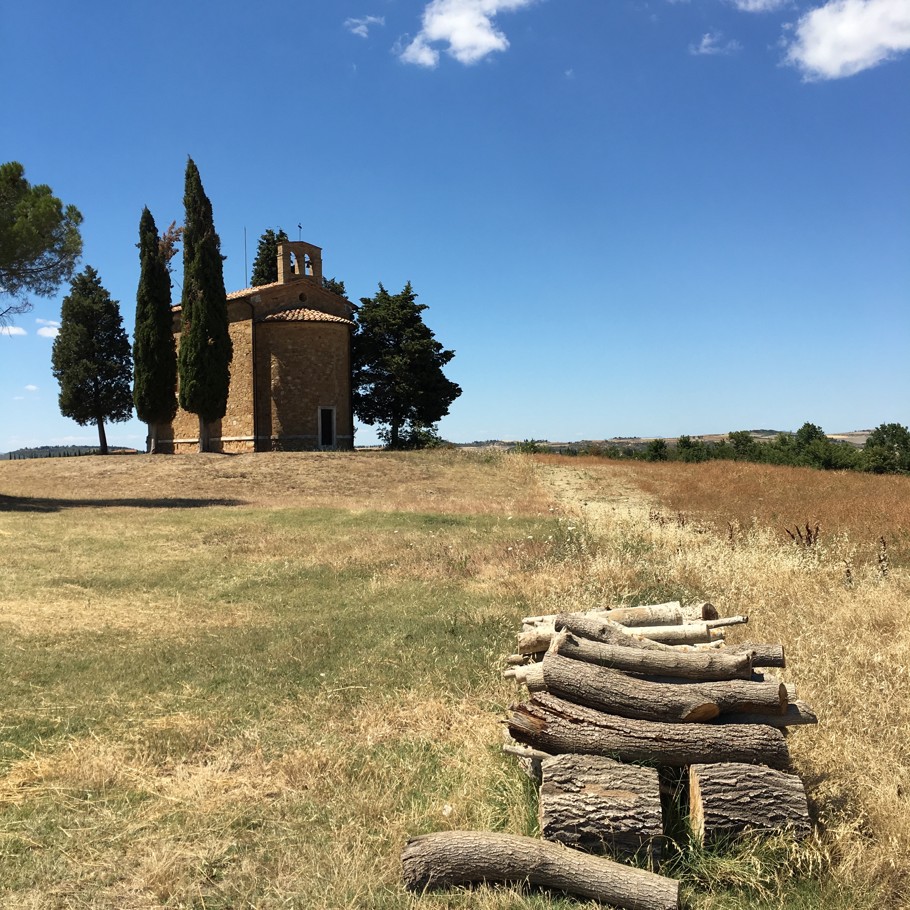 Approach from behind shows unassuming red brick facade