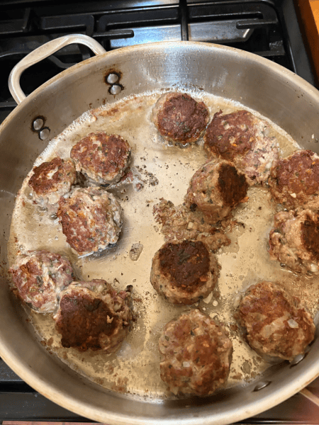 Frying the meatballs.