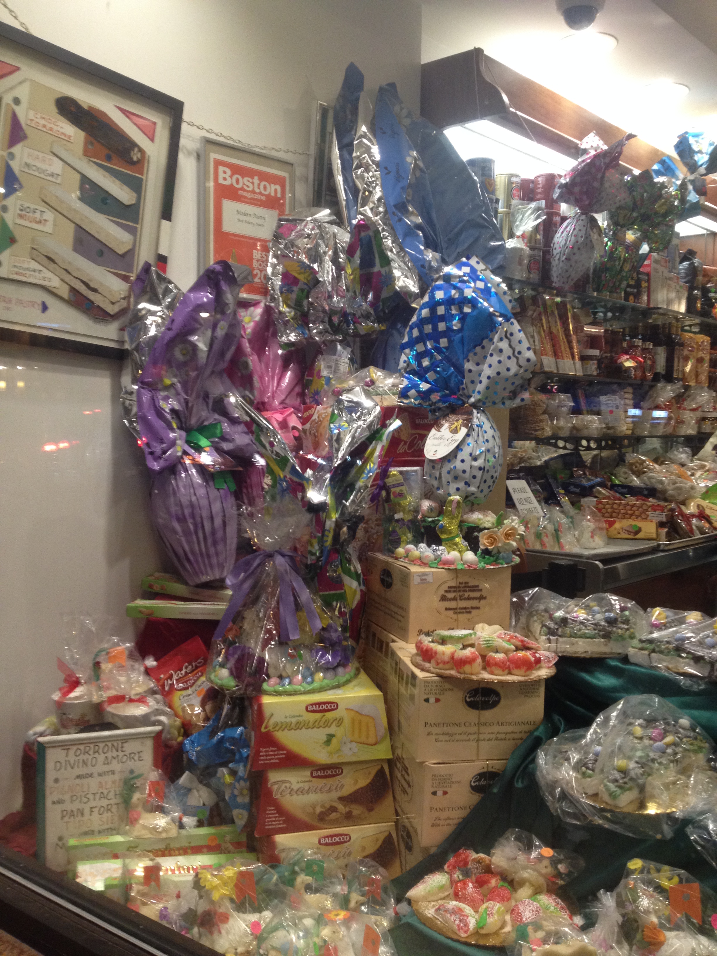 An overwhelming window display at Modern Pastry shows chocolate eggs of varying sizes.