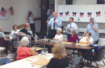 Warren Tolman thanks City Councilor Sal LaMattina during Tolman's stop at the North End's Community Center.