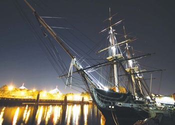 USS Constitution is moored to her pier at night in the Charlestown Navy Yard. Constitution is the oldest commissioned warship afloat and welcomes more than 500,000 visitors per year. The ship will be closed to the public until it enters dry dock on May 19. It will partially reopen on June 9. (U.S. Navy photo by Sonar Technician (Submarine) 2nd Class Thomas Rooney/Released)