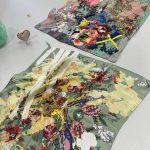 two floral printed and beaded pieces of fabric