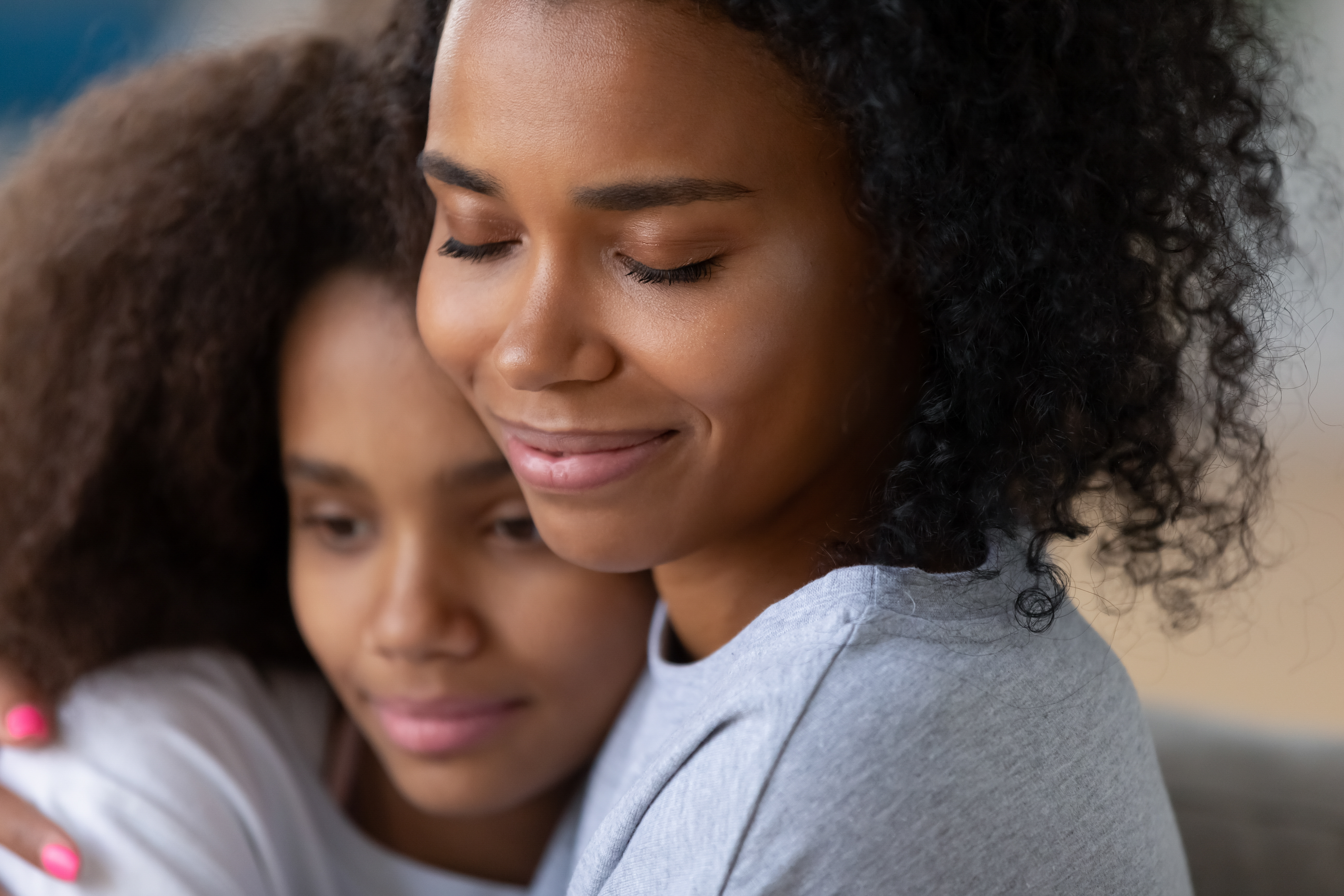 mother hugging daughter