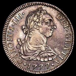 Carlos III (1759-1788). 2 reales. 1777. México. FM. (Cal-663). Ag. 6,75 gramos. Ligero tono iridiscente en el reverrso. MBC+.