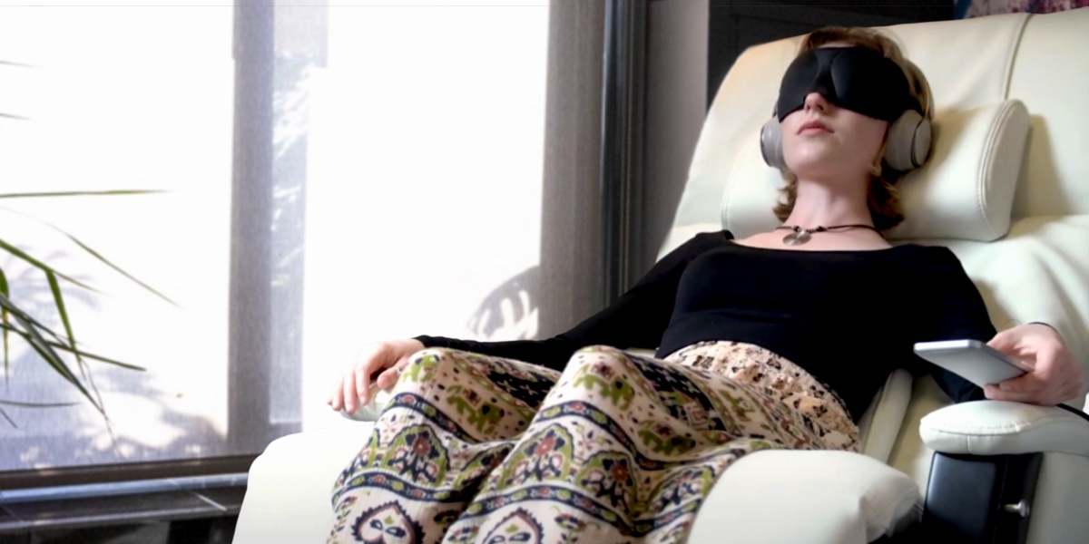 Nushama member sittingi in a chair receiving a ketamine infusion