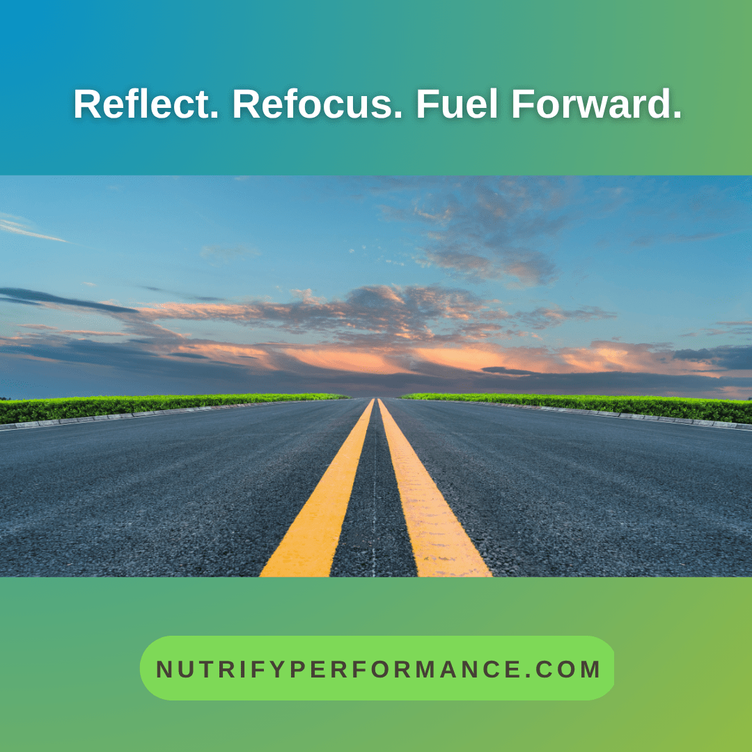 Open road at sunrise with a clear yellow center line, symbolizing direction and momentum — representing reflection, refocusing, and fueling forward toward 2026 goals.