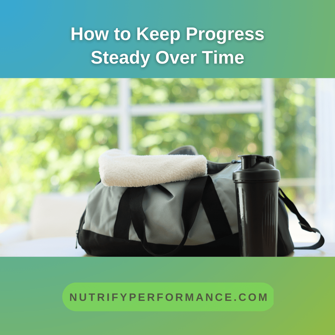 A gym bag with a towel and water bottle placed on a table near a window, representing preparation and readiness for training.