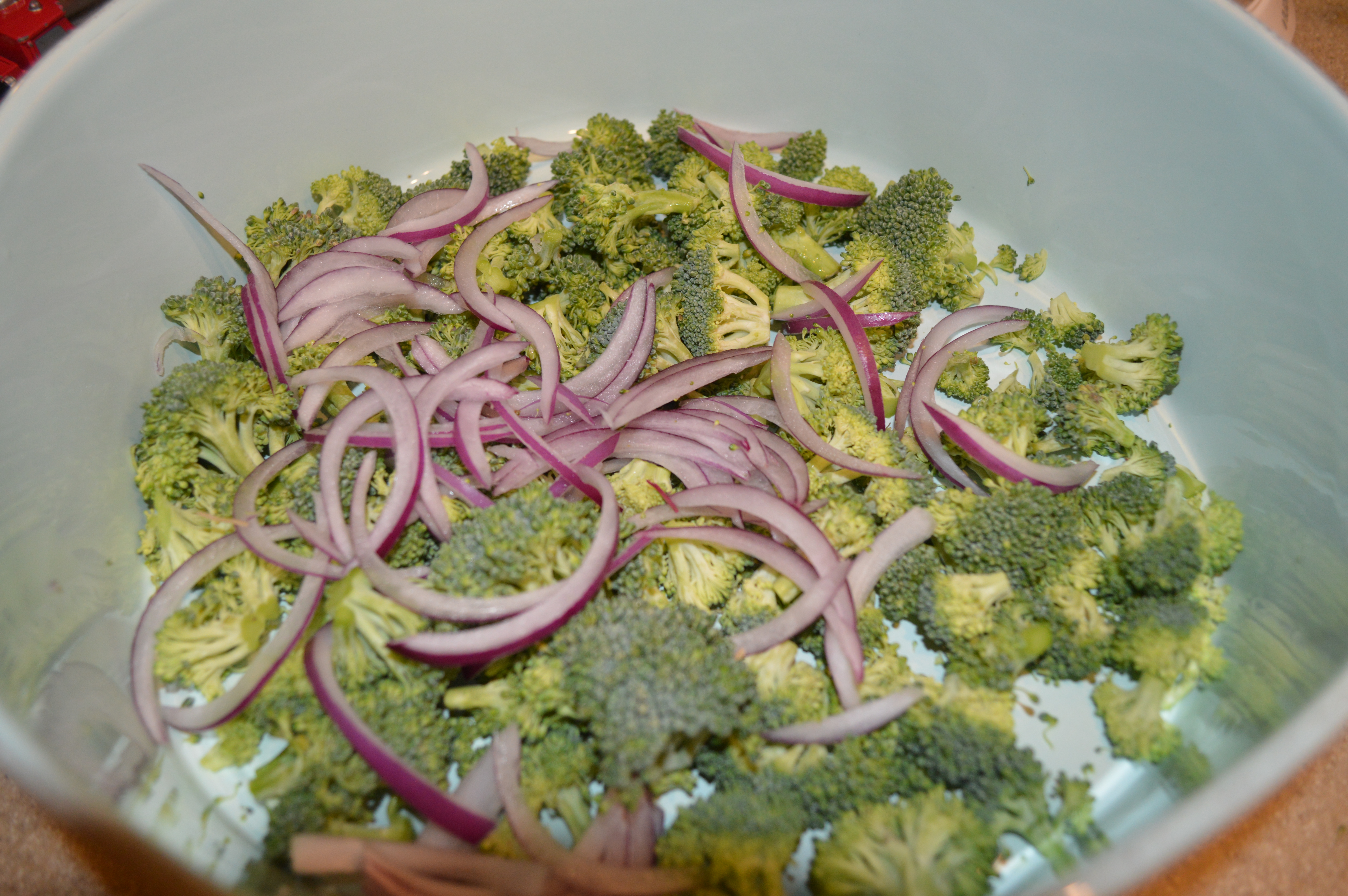 slice half red onion and combine with broccoli