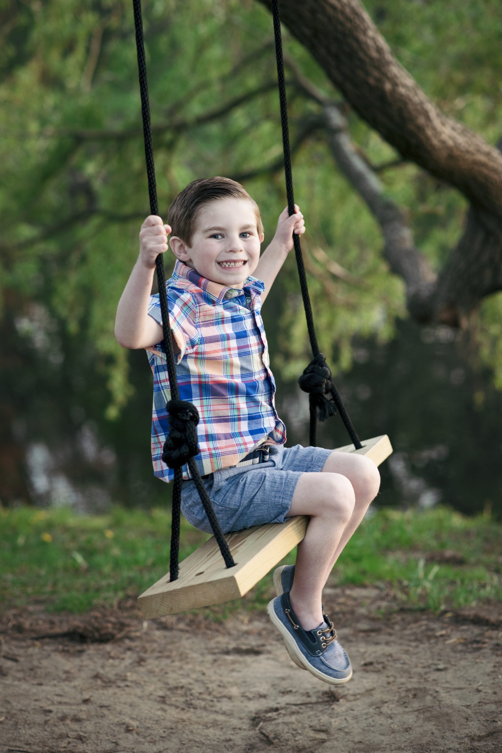 youngest brother on the swing during family portraits - Londonderry Photographer