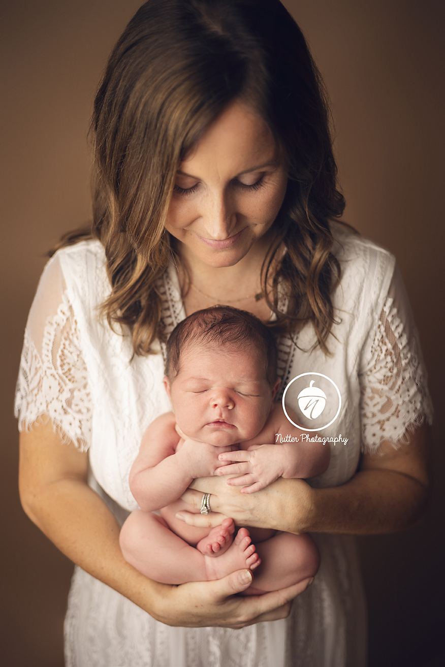 Mom holding her adorable newborn baby girl - dracut newborn photographer