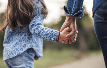 Parent guiding a child while choosing a New Zealand school
