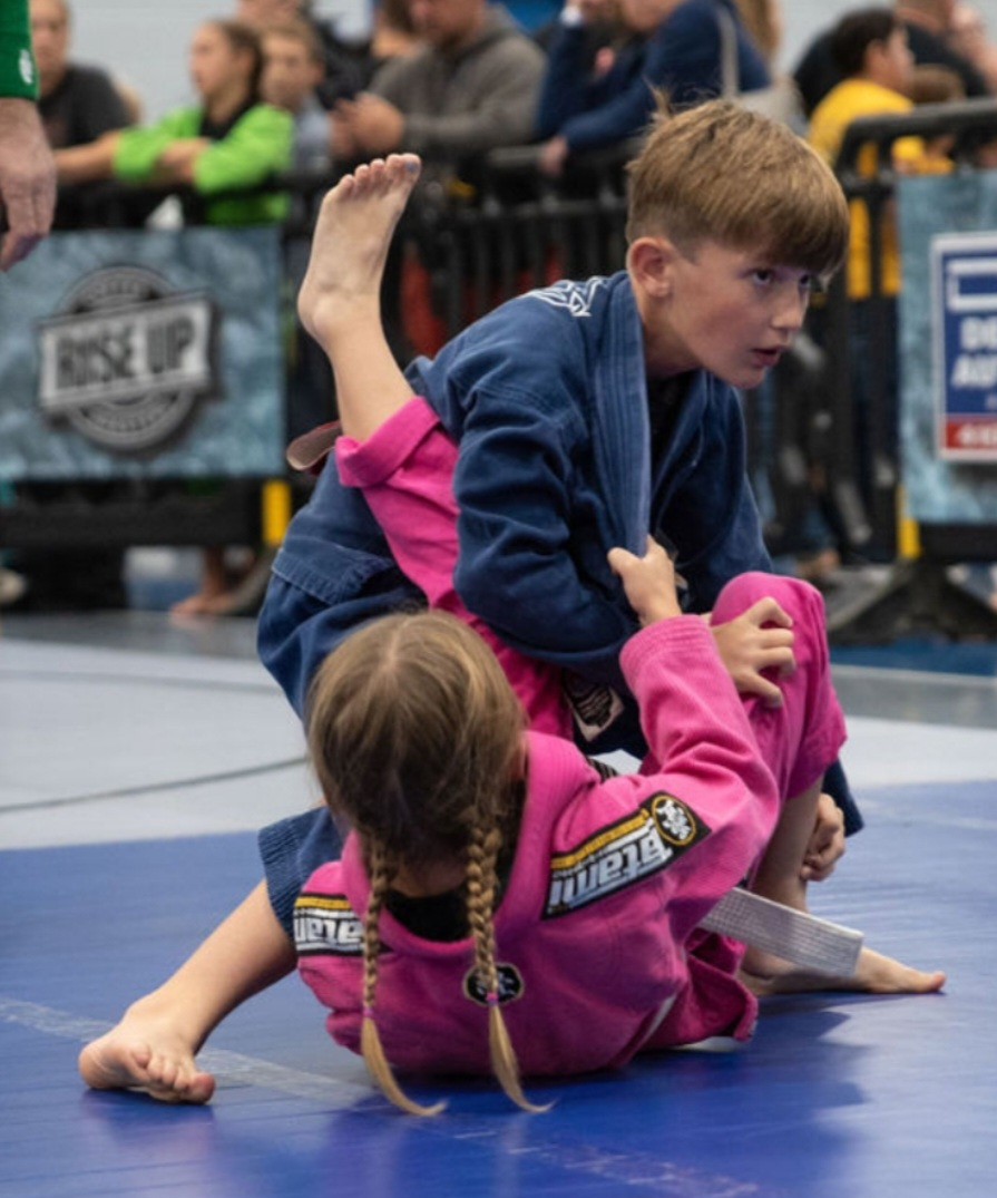boy grapeling with girl
