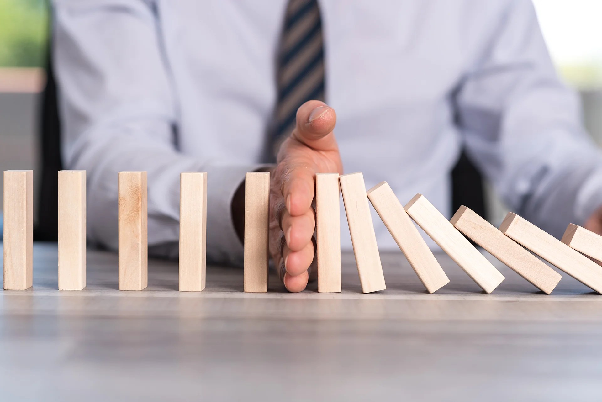 hand stopping falling blocks - shop management strategies