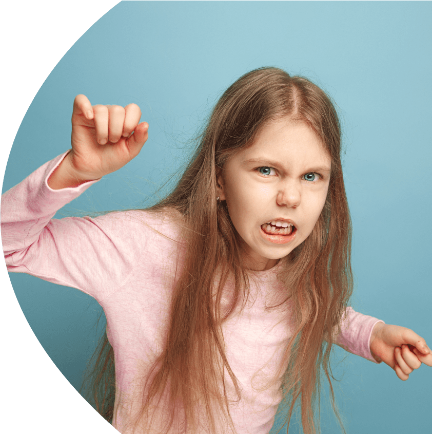 Upset girl with a clenched fist on the blue Background