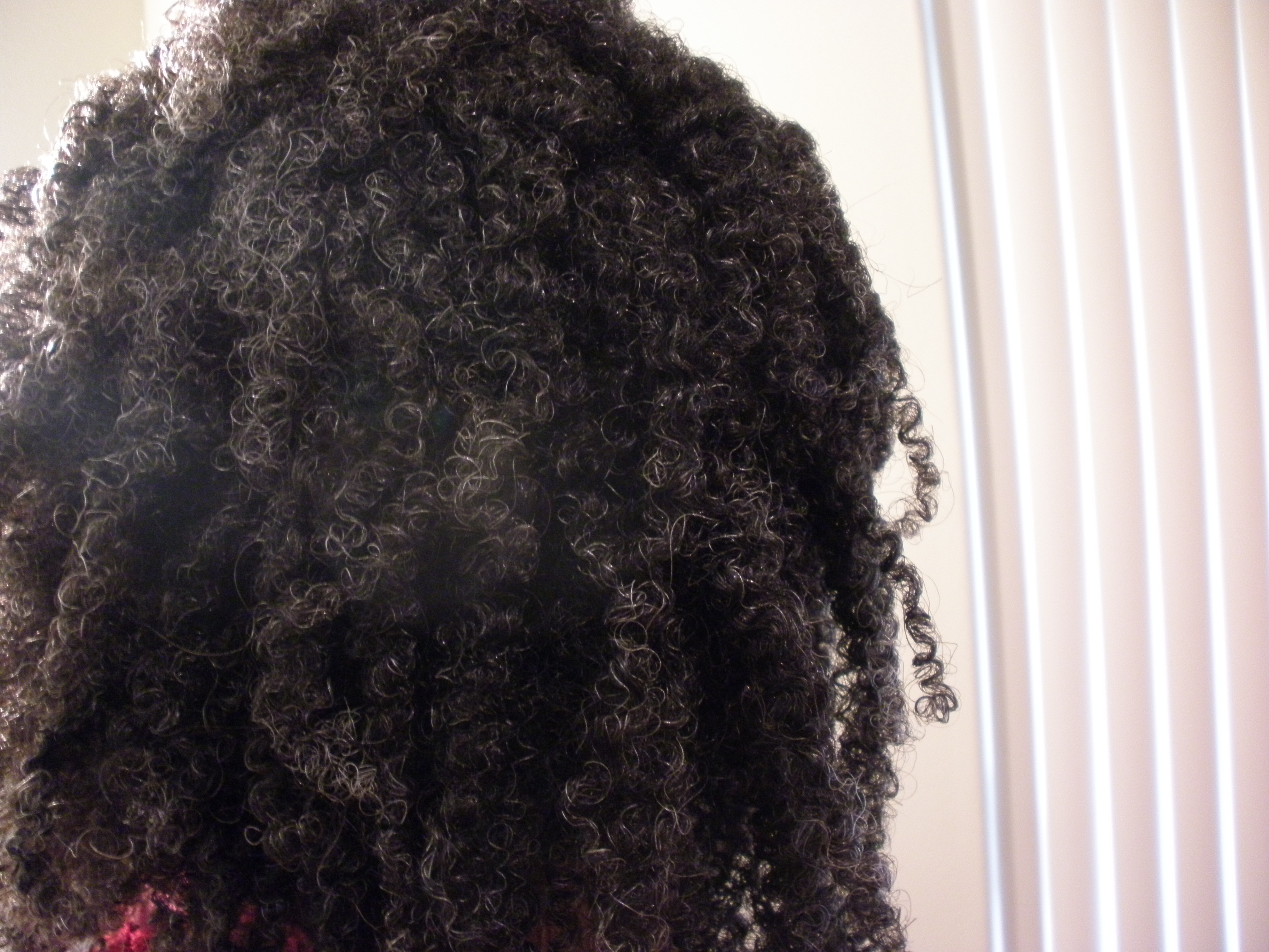 Close up of natural hair with curls defined