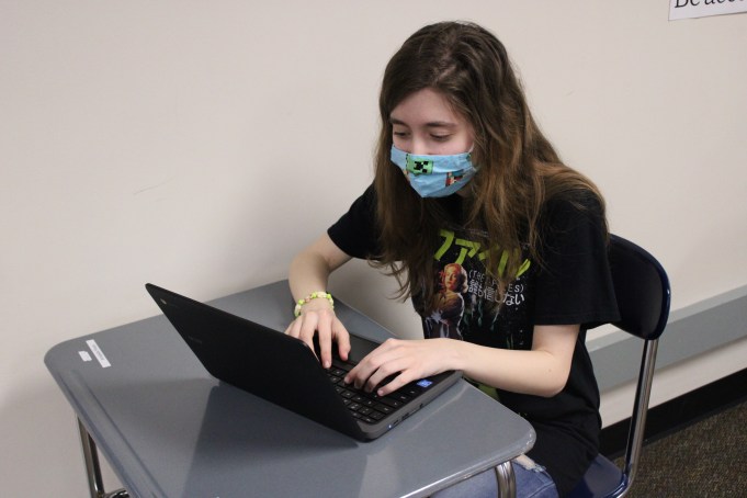 AP students given more options for 2021 exams A student sits at her desk while taking an exam on her computer.