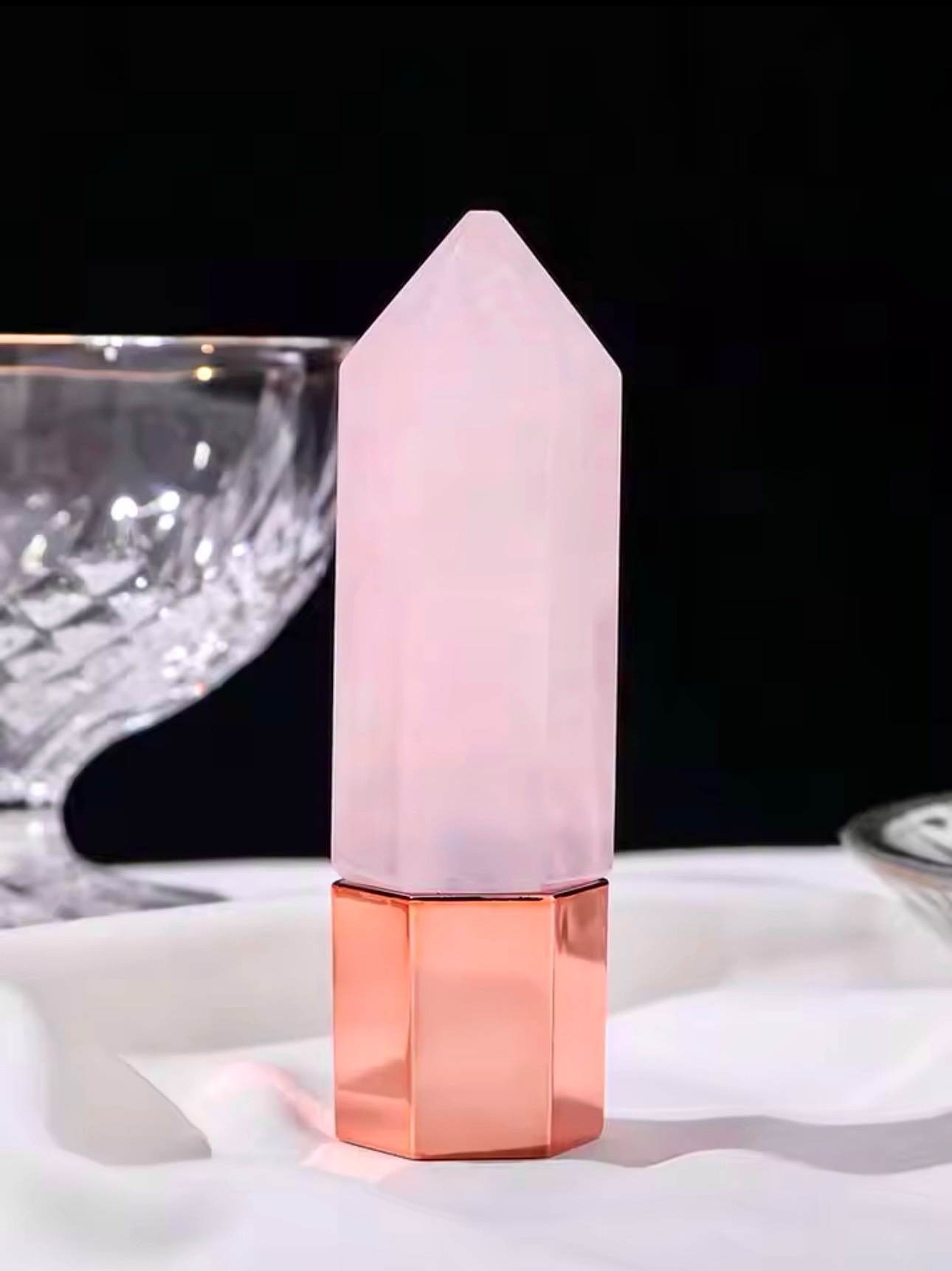 Image is of a Rose quartz roller used to apply castor oil