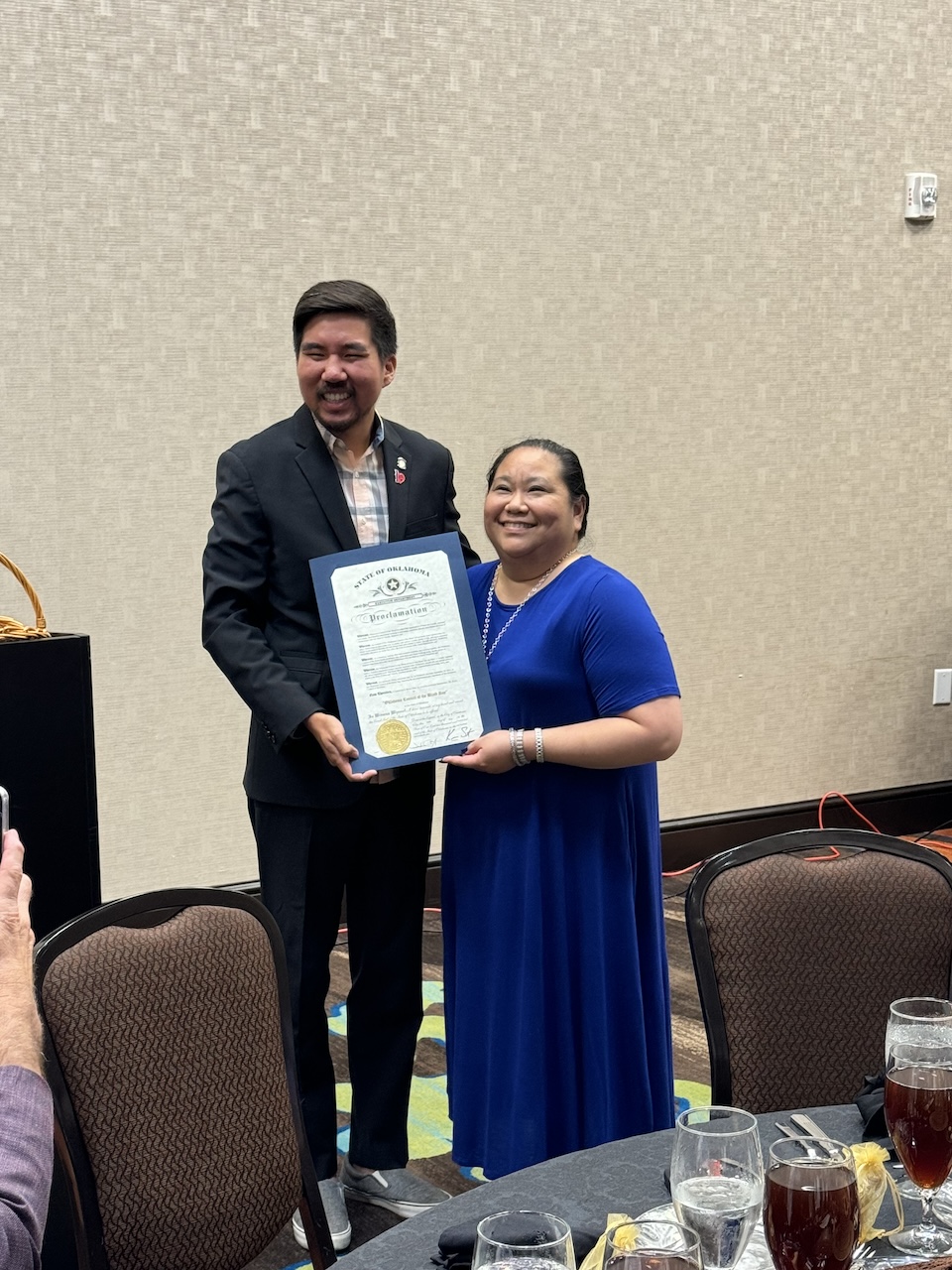 Representative Daniel Pae presenting a Proclamation for OCB with Dana Young accepting on behalf of the late Kay Love.